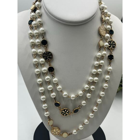 Tory Burch Authentic Long
Pearl Logo Medallion
Multi-Strand Gold 60" Necklace - Picture 15 of 15